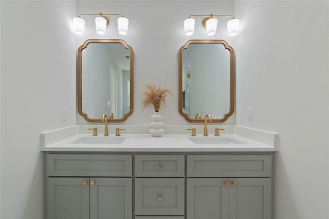 bathroom featuring double vanity and a sink
