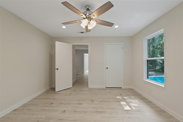 unfurnished bedroom featuring light wood-style flooring, recessed lighting, baseboards, a ceiling fan, and visible vents