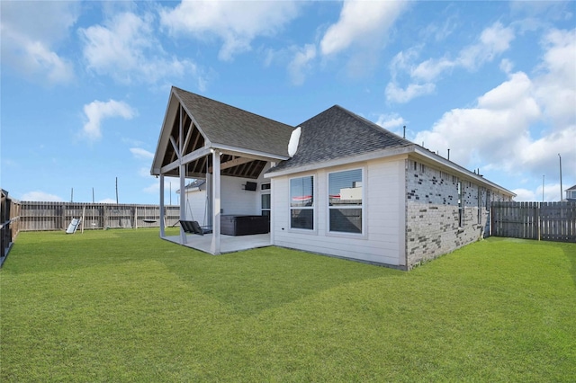 14315 Pecos Ln, Baytown, TX 77523 - rear view of property featuring roof with shingles and a patio