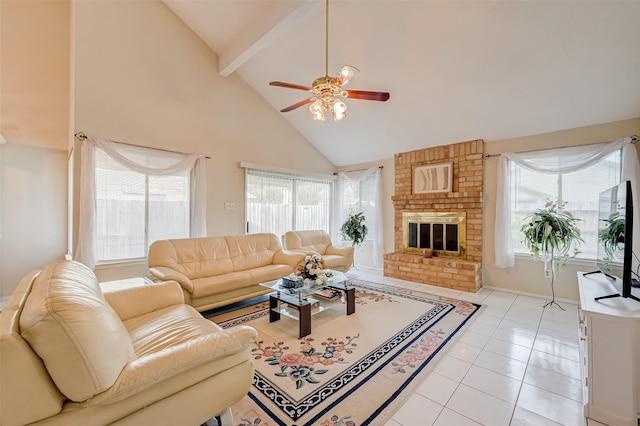 living area with high vaulted ceiling, a ceiling fan, light tile patterned floors, a brick fireplace, and beam ceiling
