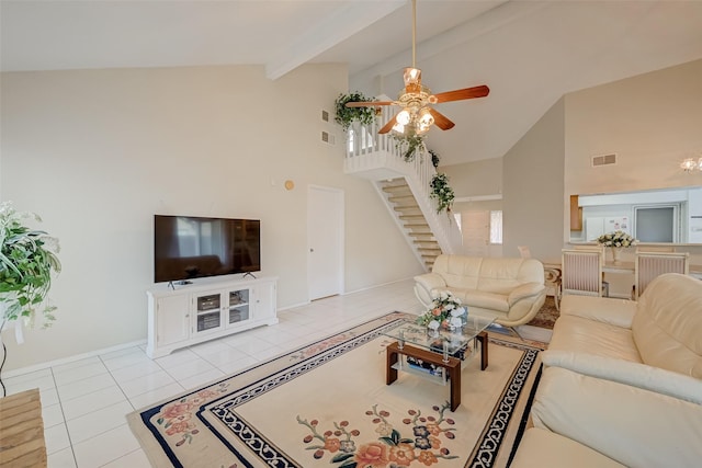 living room with high vaulted ceiling, stairs, tile patterned floors, ceiling fan, and visible vents