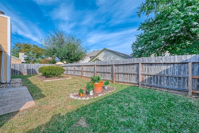 view of yard with a fenced backyard