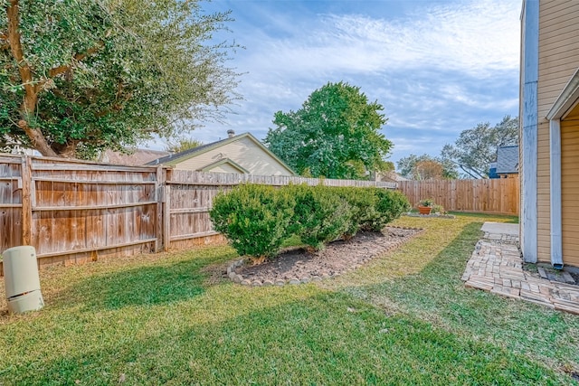 view of yard with a fenced backyard
