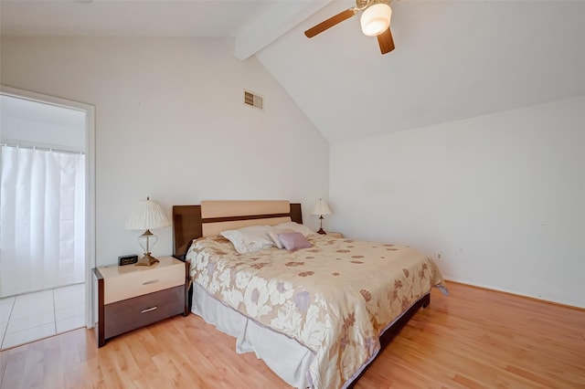 bedroom featuring lofted ceiling with beams, a ceiling fan, light wood finished floors, and visible vents