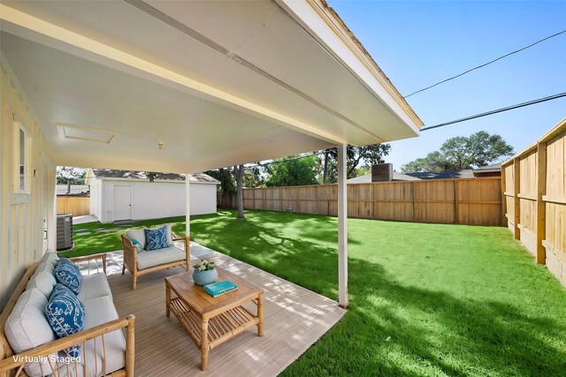 4207 Marlborough Dr, Houston, TX 77092 - view of yard featuring an outdoor living space, a storage unit, cooling unit, and an outdoor structure