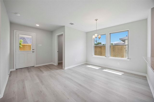 810 Clear Valley Ln, Dayton, TX 77535 - unfurnished dining area with a chandelier, healthy amount of natural light, light wood finished floors, and recessed lighting
