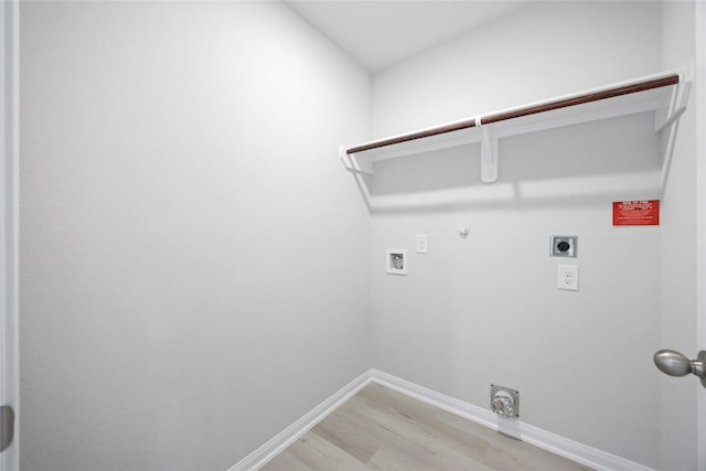 810 Clear Valley Ln, Dayton, TX 77535 - washroom with gas dryer hookup, hookup for an electric dryer, light wood-style floors, and hookup for a washing machine