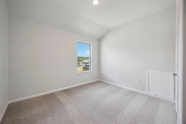 810 Clear Valley Ln, Dayton, TX 77535 - carpeted empty room featuring vaulted ceiling and baseboards