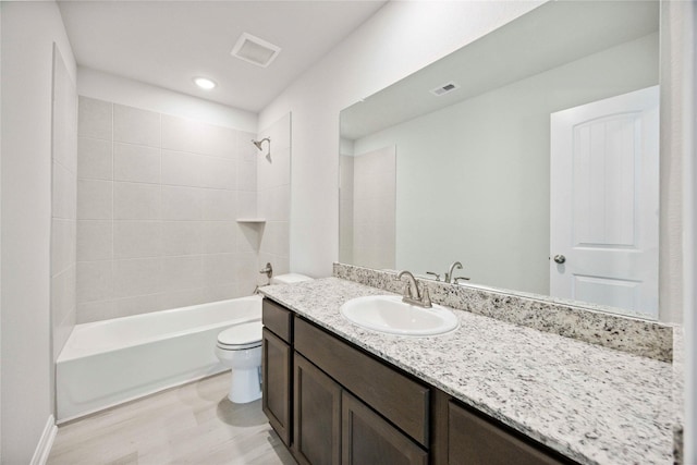 810 Clear Valley Ln, Dayton, TX 77535 - full bath featuring vanity, washtub / shower combination, wood finished floors, and recessed lighting
