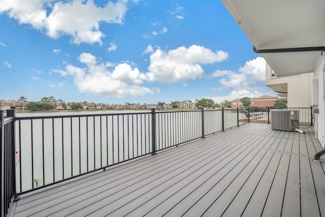 wooden terrace with central AC unit and a water view