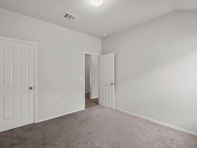 638 W Fairway Lk, Alvin, TX 77511 - unfurnished bedroom with carpet floors, baseboards, and lofted ceiling