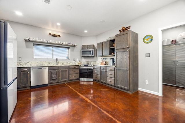 kitchen featuring concrete floors, open shelves, stainless steel appliances, and recessed lighting