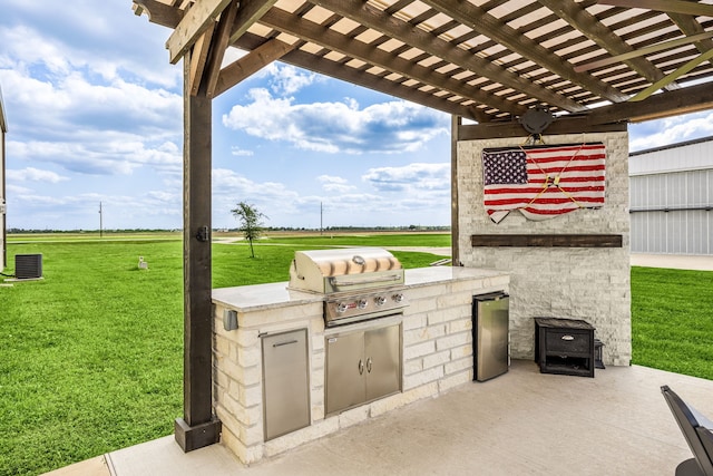 view of patio / terrace with a pergola and area for grilling