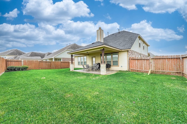 3901 Penny Ln, Deer Park, TX 77536 - rear view of property featuring a patio area, a chimney, and roof with shingles
