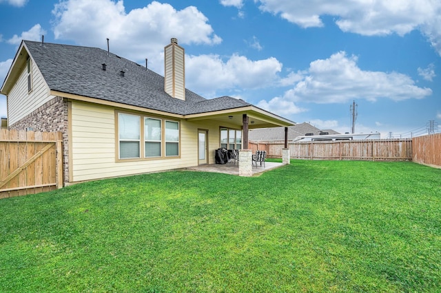 3901 Penny Ln, Deer Park, TX 77536 - back of house featuring a patio, a chimney, and a shingled roof