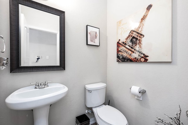 3901 Penny Ln, Deer Park, TX 77536 - half bathroom with toilet and a sink