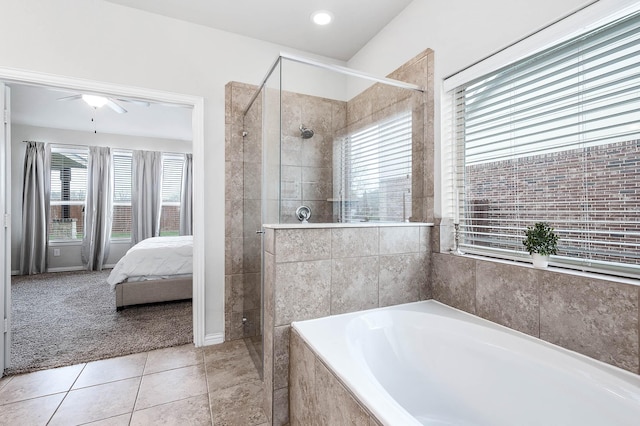 3901 Penny Ln, Deer Park, TX 77536 - full bathroom with a shower stall, ensuite bathroom, a bath, and tile patterned flooring