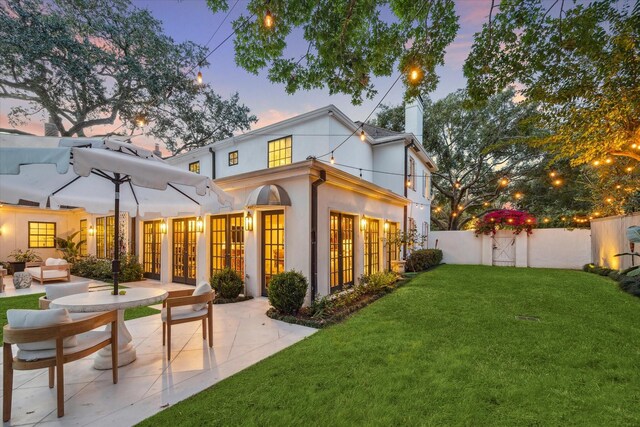 2129 Brentwood Dr, Houston, TX 77019 - rear view of house with a yard, french doors, a patio, and fence