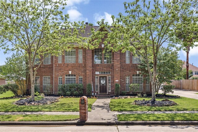 1509 Shamrock Ln, Deer Park, TX 77536 - colonial inspired home featuring brick siding