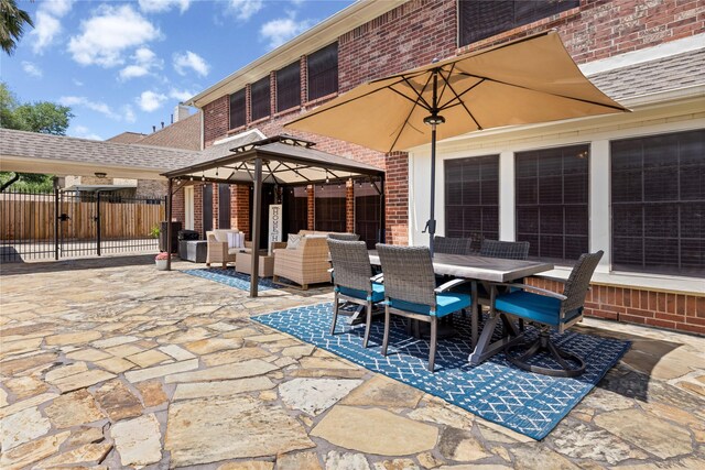 1509 Shamrock Ln, Deer Park, TX 77536 - view of patio with outdoor dining area, a gazebo, and a gate