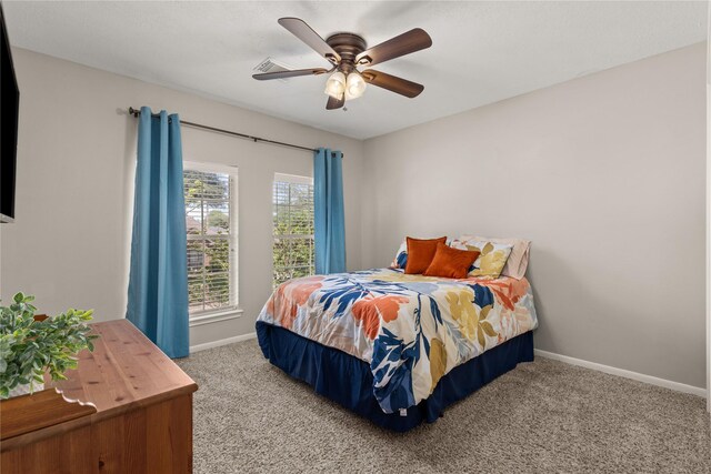 1509 Shamrock Ln, Deer Park, TX 77536 - bedroom with carpet floors, baseboards, and ceiling fan