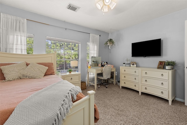 1509 Shamrock Ln, Deer Park, TX 77536 - carpeted bedroom with a desk and ceiling fan