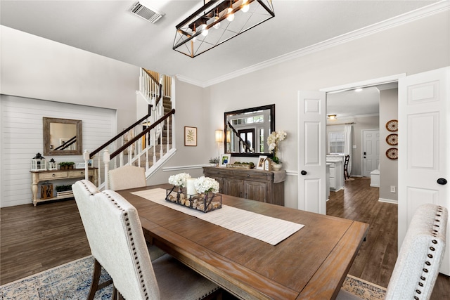 1509 Shamrock Ln, Deer Park, TX 77536 - dining space with ornamental molding, dark wood finished floors, stairs, a chandelier, and baseboards