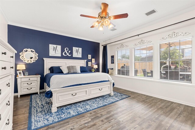 1509 Shamrock Ln, Deer Park, TX 77536 - bedroom with ornamental molding, dark wood-style floors, baseboards, and a ceiling fan