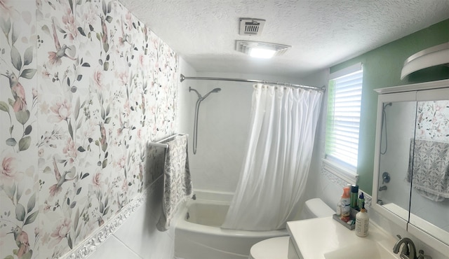 5111 Rockland Dr, Pearland, TX 77584 - full bath with shower / tub combo with curtain, toilet, a textured ceiling, and vanity