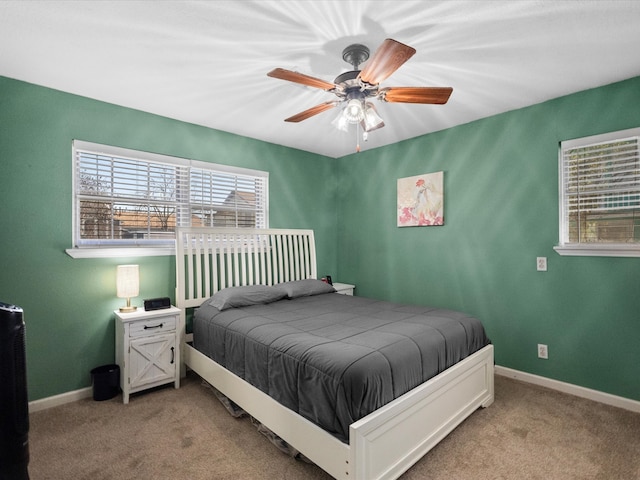 1901 49th St, Galveston, TX 77551 - bedroom featuring light colored carpet, baseboards, and a ceiling fan
