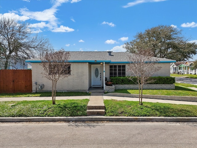 1901 49th St, Galveston, TX 77551 - view of front of home with fence and brick siding