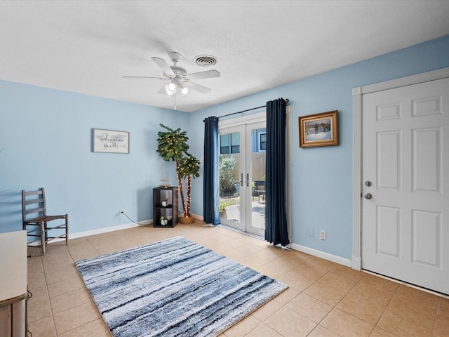 1901 49th St, Galveston, TX 77551 - tiled entrance foyer with baseboards, a ceiling fan, and visible vents