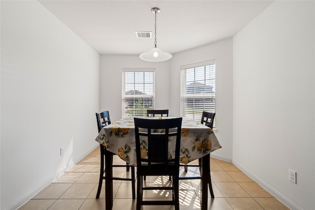 dining area with visible vents, baseboards, and light tile patterned floors