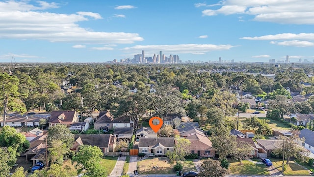 birds eye view of property featuring a residential view and a view of city