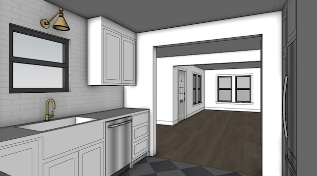 kitchen with dark floors, white cabinets, dishwasher, a sink, and decorative backsplash