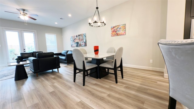 1106 Adele St, Houston, TX 77009 - dining space featuring recessed lighting, baseboards, light wood-style flooring, and ceiling fan with notable chandelier