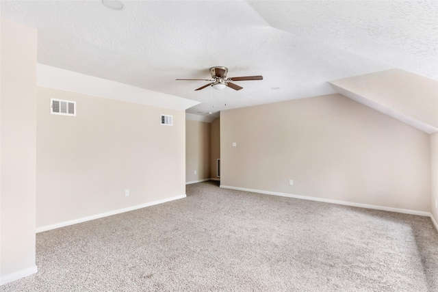21014 Angus Dr, Cleveland, TX 77328 - interior space with vaulted ceiling, visible vents, carpet, and ceiling fan
