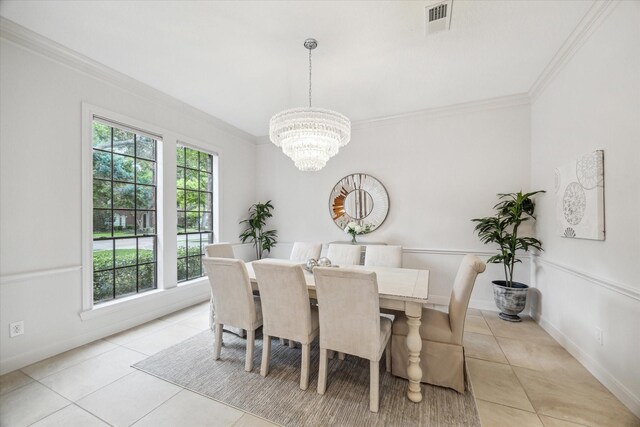 14 Tredington St, Sugar Land, TX 77479 - dining room featuring light tile patterned flooring, ornamental molding, a chandelier, and baseboards