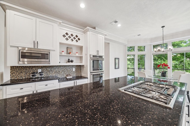 14 Tredington St, Sugar Land, TX 77479 - kitchen with stainless steel appliances, open shelves, a chandelier, white cabinets, and backsplash