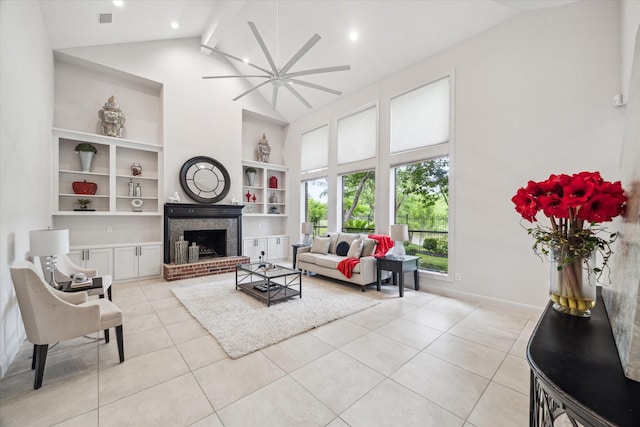 14 Tredington St, Sugar Land, TX 77479 - living area with high vaulted ceiling, light tile patterned floors, ceiling fan, built in features, and a brick fireplace