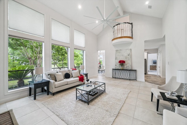 14 Tredington St, Sugar Land, TX 77479 - living area featuring high vaulted ceiling, plenty of natural light, beam ceiling, light tile patterned floors, and ceiling fan
