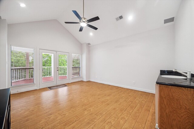 14 Tredington St, Sugar Land, TX 77479 - unfurnished living room featuring a sink, high vaulted ceiling, a ceiling fan, light wood finished floors, and baseboards