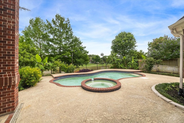 14 Tredington St, Sugar Land, TX 77479 - view of swimming pool with a patio area, a fenced backyard, and a pool with connected hot tub