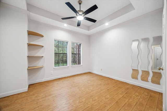 14 Tredington St, Sugar Land, TX 77479 - unfurnished room featuring light wood finished floors, a ceiling fan, a raised ceiling, ornamental molding, and baseboards