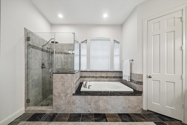 14 Tredington St, Sugar Land, TX 77479 - bathroom with a bath, a stall shower, recessed lighting, and baseboards