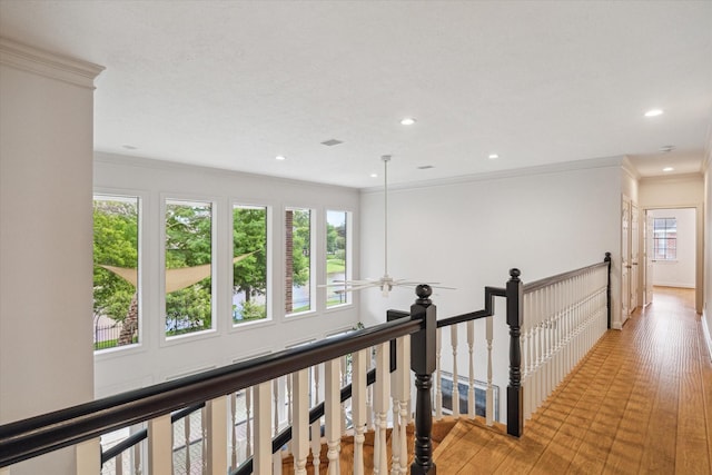14 Tredington St, Sugar Land, TX 77479 - hall with an upstairs landing, crown molding, recessed lighting, and light wood-type flooring