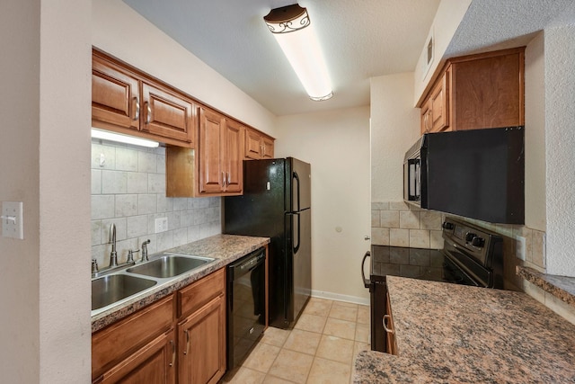 904 University Oaks Blvd Unit 92, College Station, TX 77840 - kitchen with a sink, tasteful backsplash, black appliances, brown cabinets, and light tile patterned floors