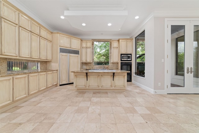 kitchen featuring light brown cabinets, tasteful backsplash, built in appliances, french doors, and ornamental molding