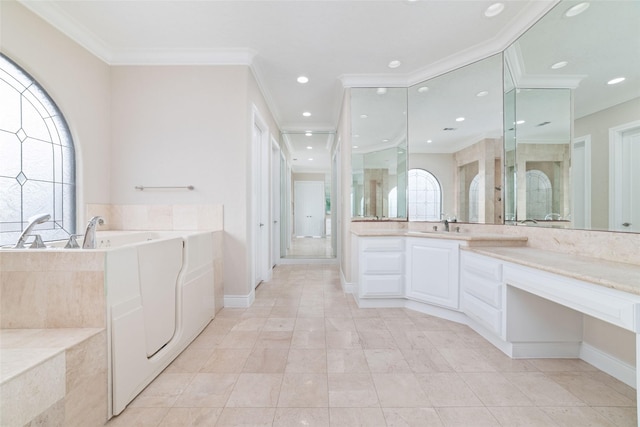 full bathroom featuring baseboards, recessed lighting, crown molding, a garden tub, and vanity