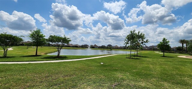 19210 Palfrey Prairie Trl, Tomball, TX 77377 - view of community featuring a residential view, a water view, and a lawn